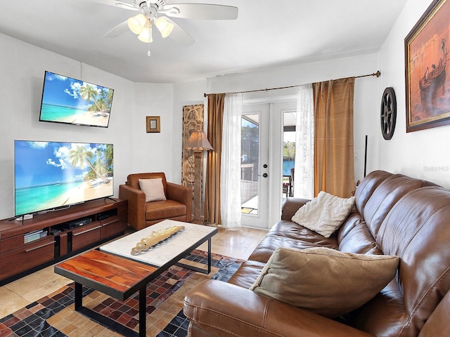 tiled living room featuring ceiling fan and french doors