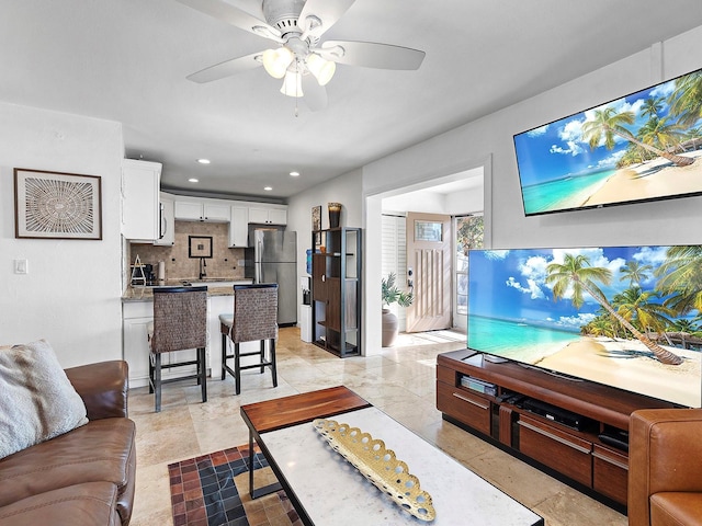 living room featuring ceiling fan