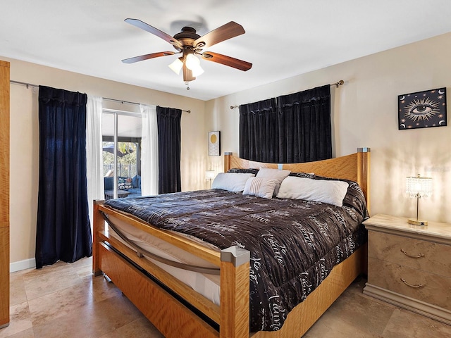 bedroom featuring ceiling fan and access to exterior