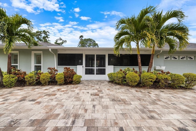 view of exterior entry with a garage