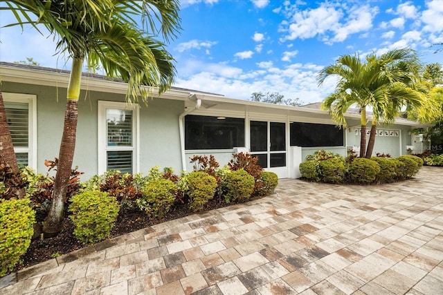 doorway to property featuring a garage