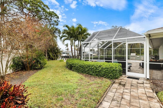 view of yard with glass enclosure