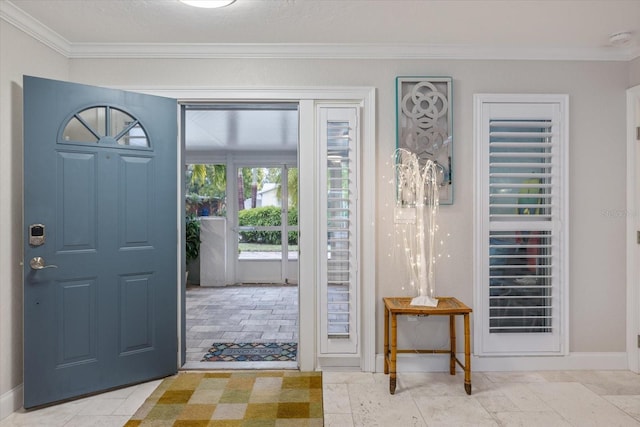 foyer featuring ornamental molding