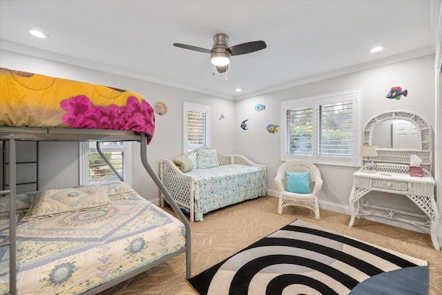 bedroom with crown molding, ceiling fan, and carpet flooring