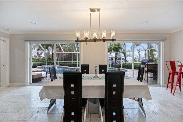 dining room featuring an inviting chandelier and ornamental molding