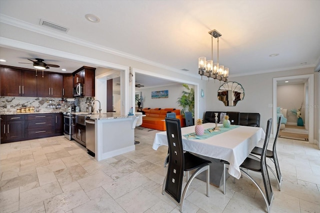 dining space featuring ornamental molding and ceiling fan with notable chandelier