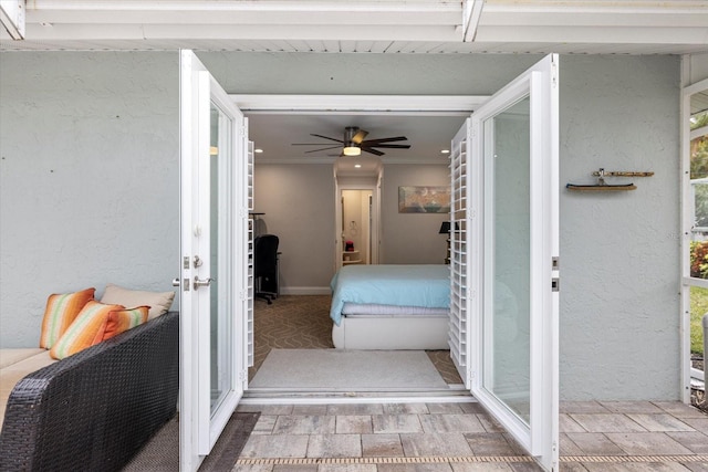 hallway featuring ornamental molding and french doors