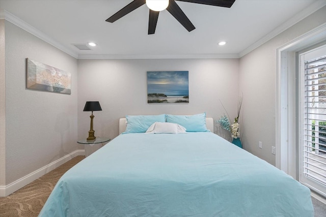 carpeted bedroom with ornamental molding and ceiling fan