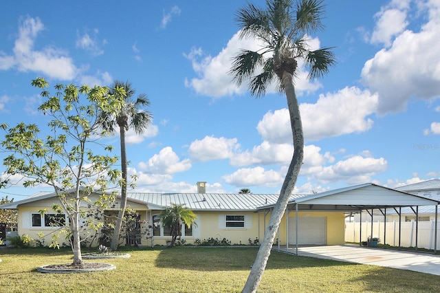 view of front of home with a garage and a front yard