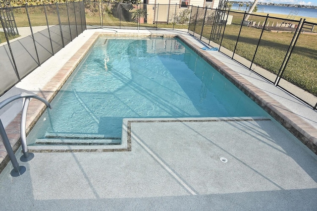 view of swimming pool with a water view and a lanai