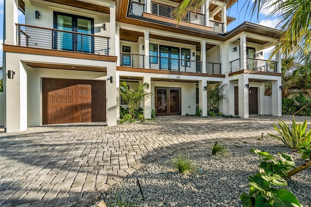 view of front of property with french doors and a garage