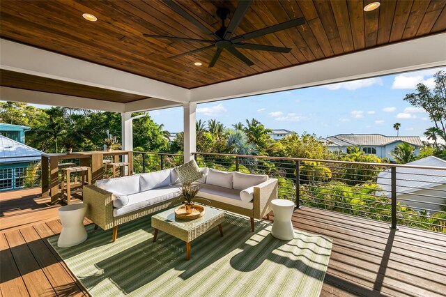 wooden terrace featuring outdoor lounge area and ceiling fan