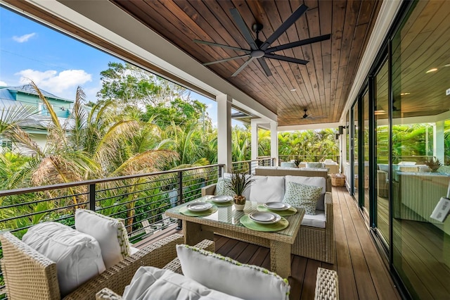 balcony with ceiling fan and an outdoor living space