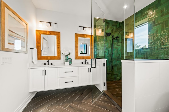 bathroom featuring vanity and a shower with shower door