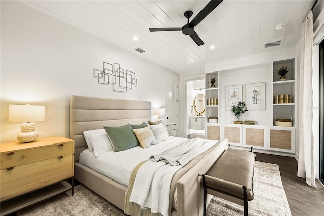 bedroom with dark wood-type flooring, ceiling fan, and wooden ceiling