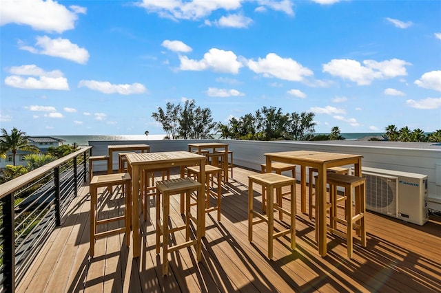 wooden deck with a water view