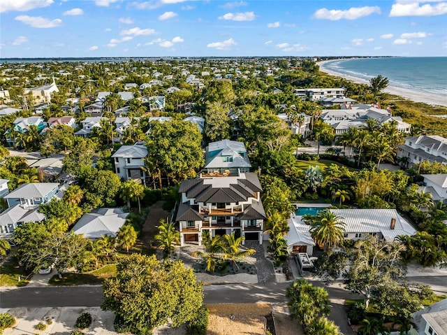 drone / aerial view featuring a water view and a beach view