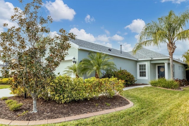 view of property exterior with a garage and a yard