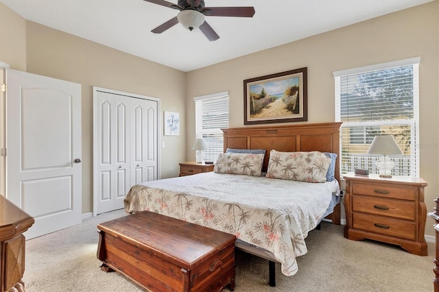 bedroom featuring light carpet, a closet, and ceiling fan