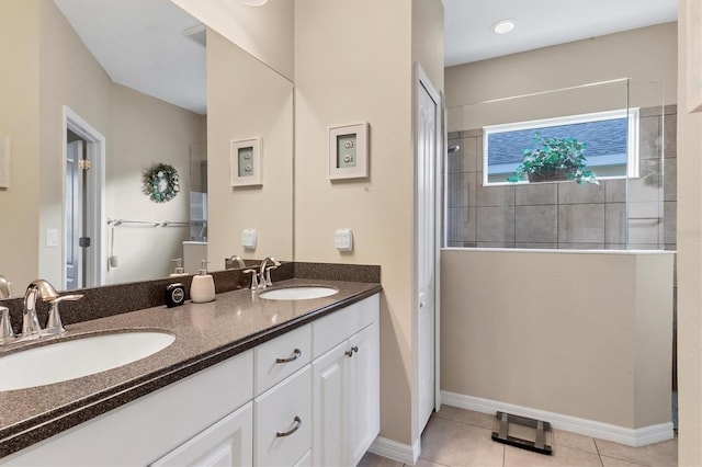 bathroom featuring tile patterned flooring and vanity