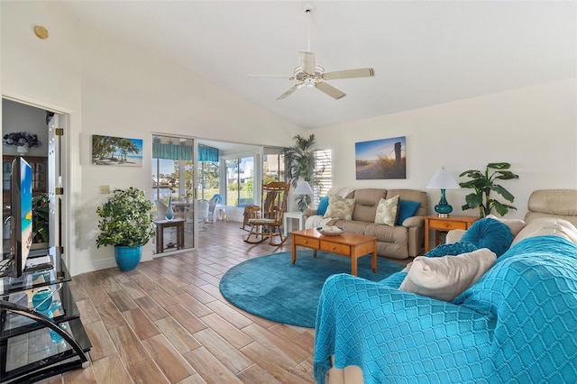 living room with high vaulted ceiling and ceiling fan