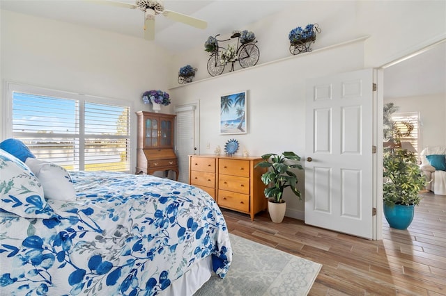 bedroom with light hardwood / wood-style floors and ceiling fan