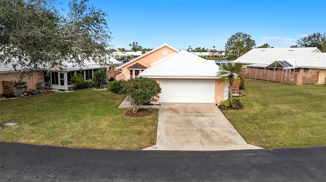 ranch-style home featuring a garage and a front yard