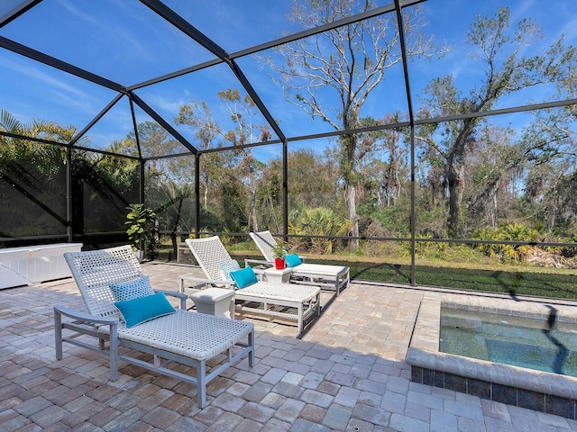 view of patio / terrace featuring glass enclosure