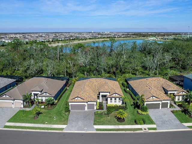 birds eye view of property with a water view