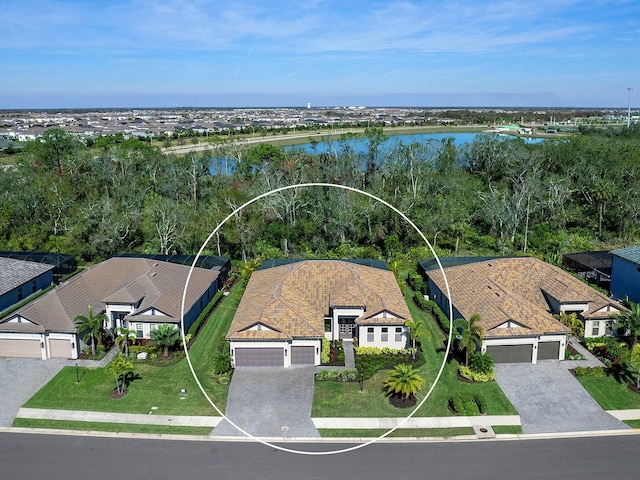 birds eye view of property with a water view