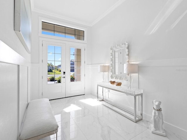 foyer entrance featuring french doors and ornamental molding