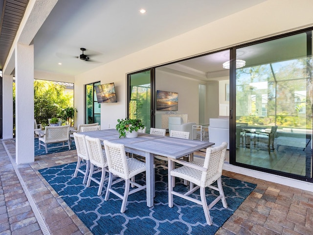 view of patio / terrace with outdoor dining area and a ceiling fan