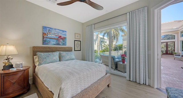 bedroom featuring light hardwood / wood-style flooring, access to outside, and ceiling fan