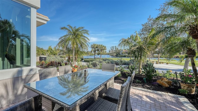 view of patio featuring a water view