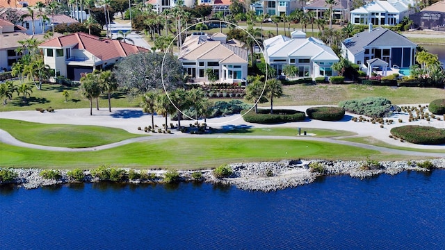 birds eye view of property with a water view