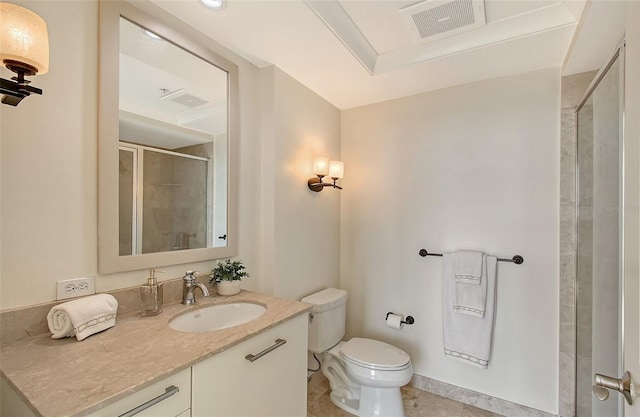 bathroom featuring walk in shower, tile patterned floors, vanity, and toilet