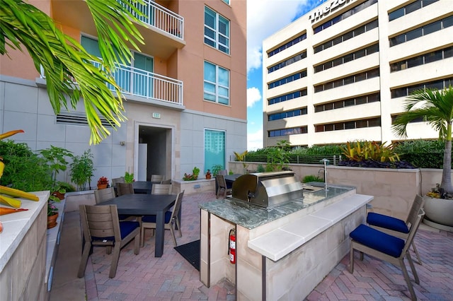 view of patio with a grill and an outdoor kitchen