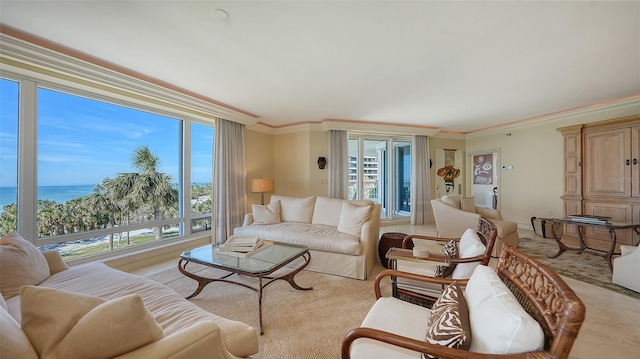 living room featuring ornamental molding and a water view