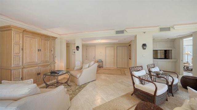 living room with ornamental molding