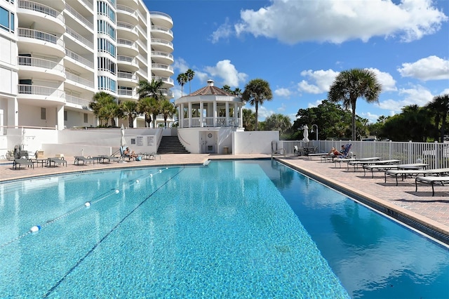 view of pool featuring a gazebo and a patio area