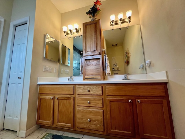 bathroom with tile patterned floors and vanity