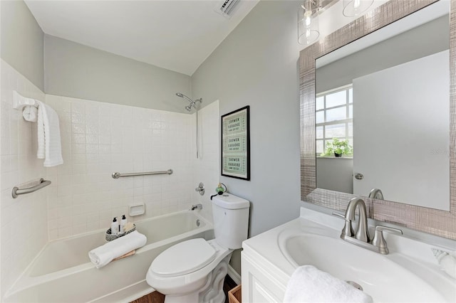 bathroom featuring visible vents, vanity, bathtub / shower combination, and toilet