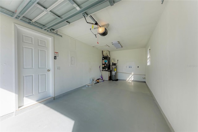 garage with heating unit, water heater, and a garage door opener