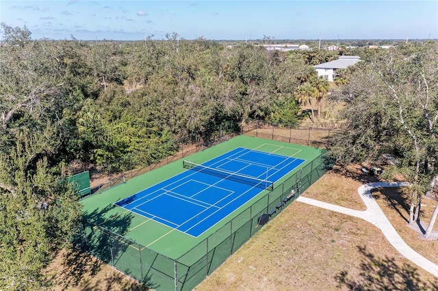 view of sport court with fence