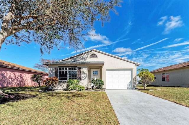 ranch-style house with a garage, concrete driveway, a front lawn, and stucco siding