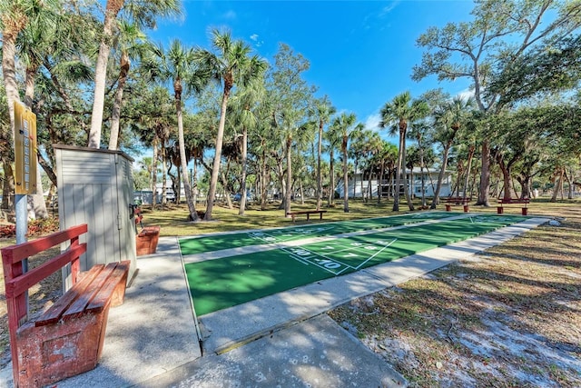 view of home's community featuring shuffleboard