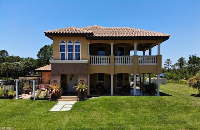 rear view of house featuring a yard and a patio area