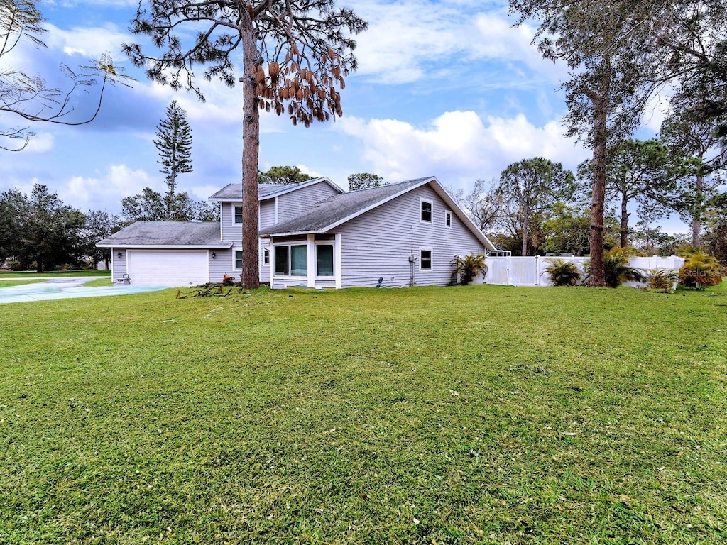 view of front of home with a garage and a front yard