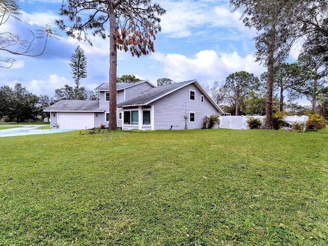 view of front of home with a garage and a front yard