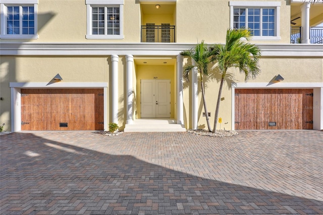 view of exterior entry featuring a garage